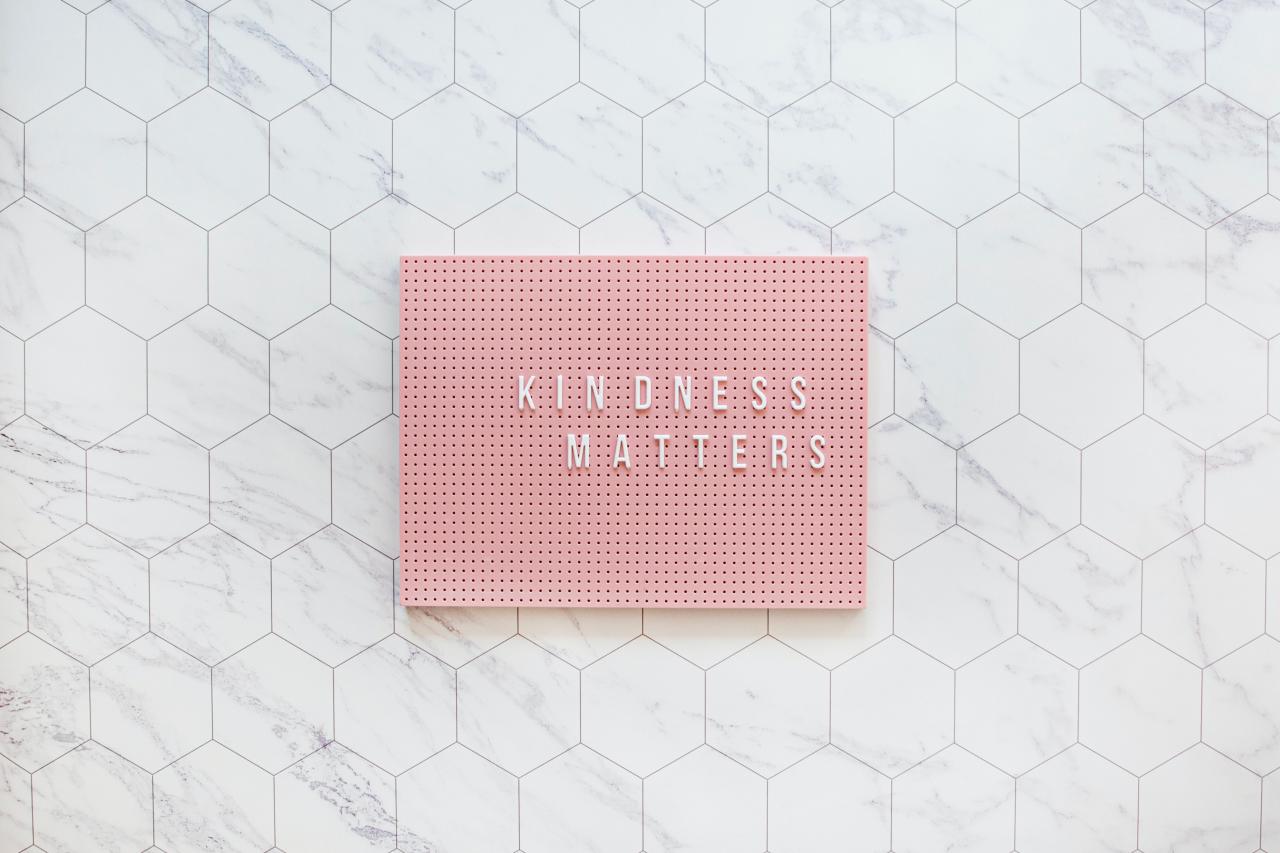 Kindness matters written on a pegboard