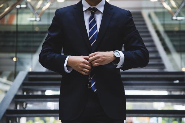 Businessman in suit ready for measuring sustainability