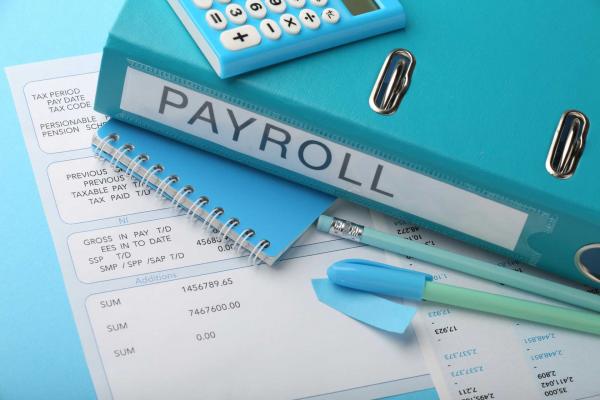 payroll giving benefits, A close up image of payroll processing documents