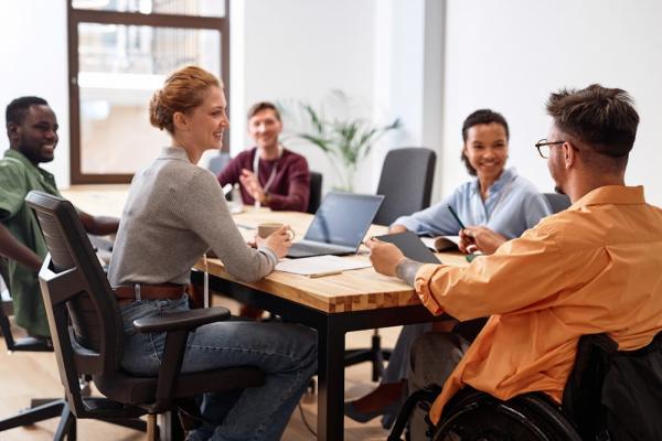 A diverse team sharing ESG responsibilities through cross-functional CSR management practices.